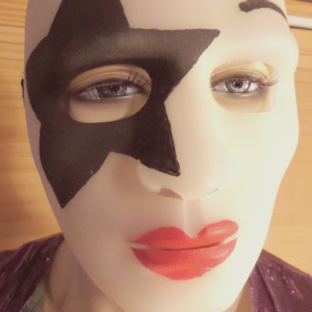 A Star Child hand painted face mask